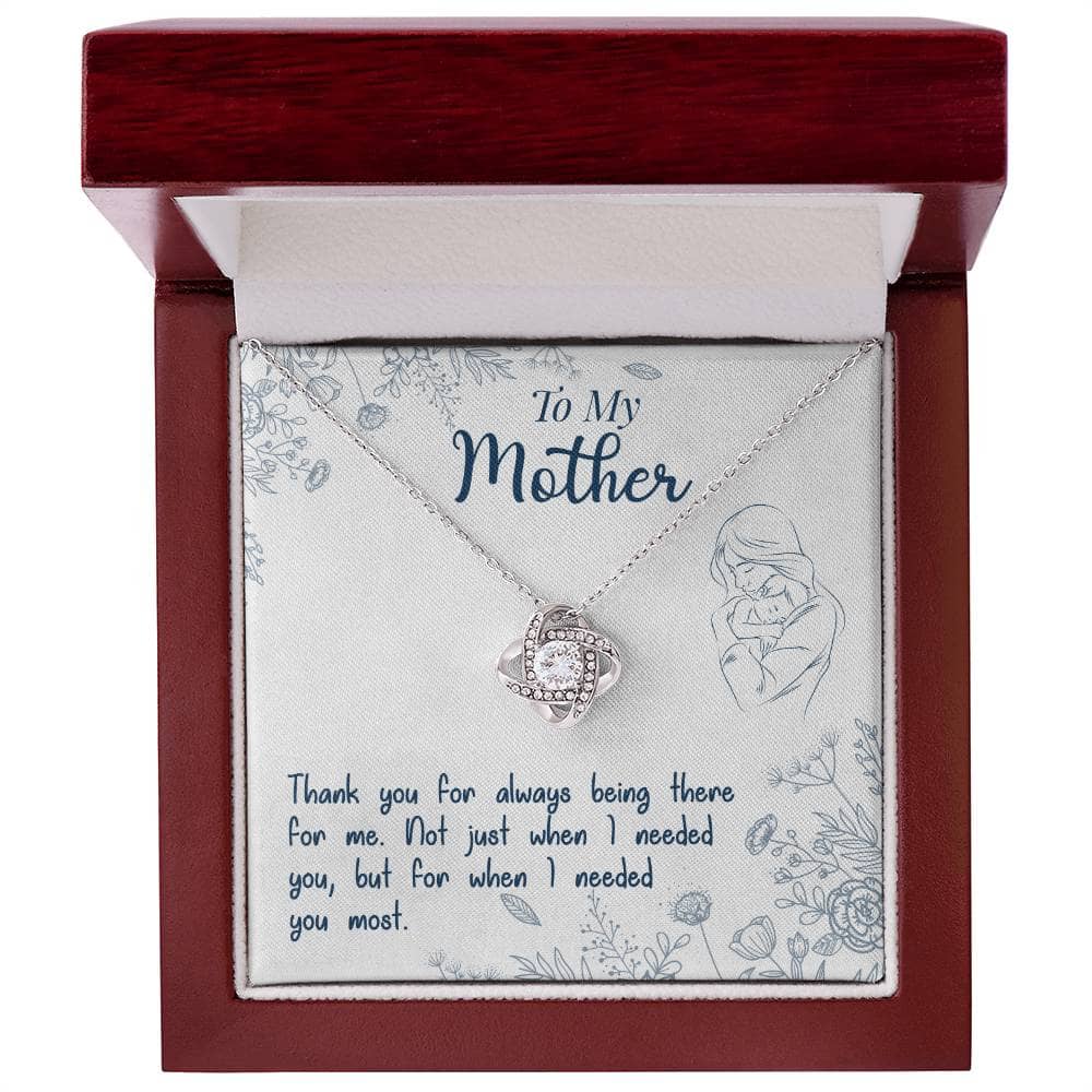 A close-up of the Personalized Mother Necklace - Premium Love Knot Gift, featuring a heart-shaped pendant adorned with cubic zirconia crystals.
