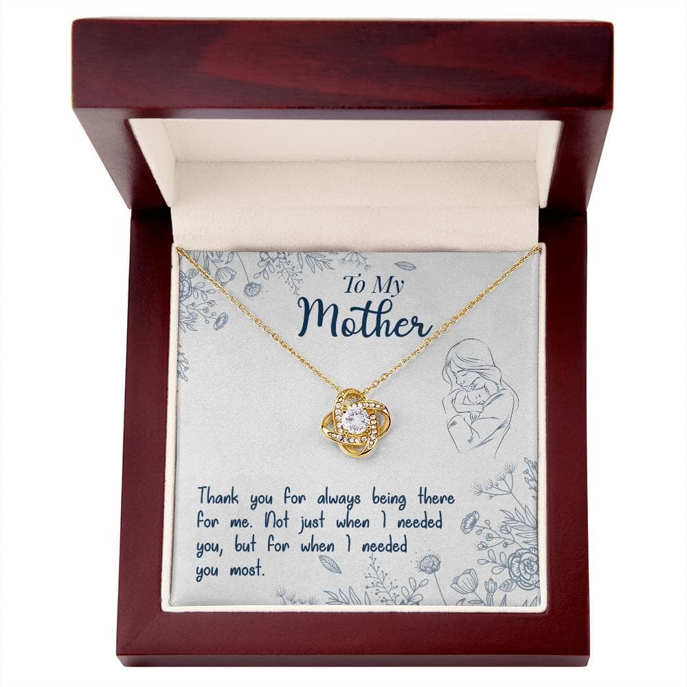 Alt text: "Personalized Mother Necklace - Premium Love Knot Gift: A necklace in a box with a heart-shaped pendant adorned with cubic zirconia crystals."
