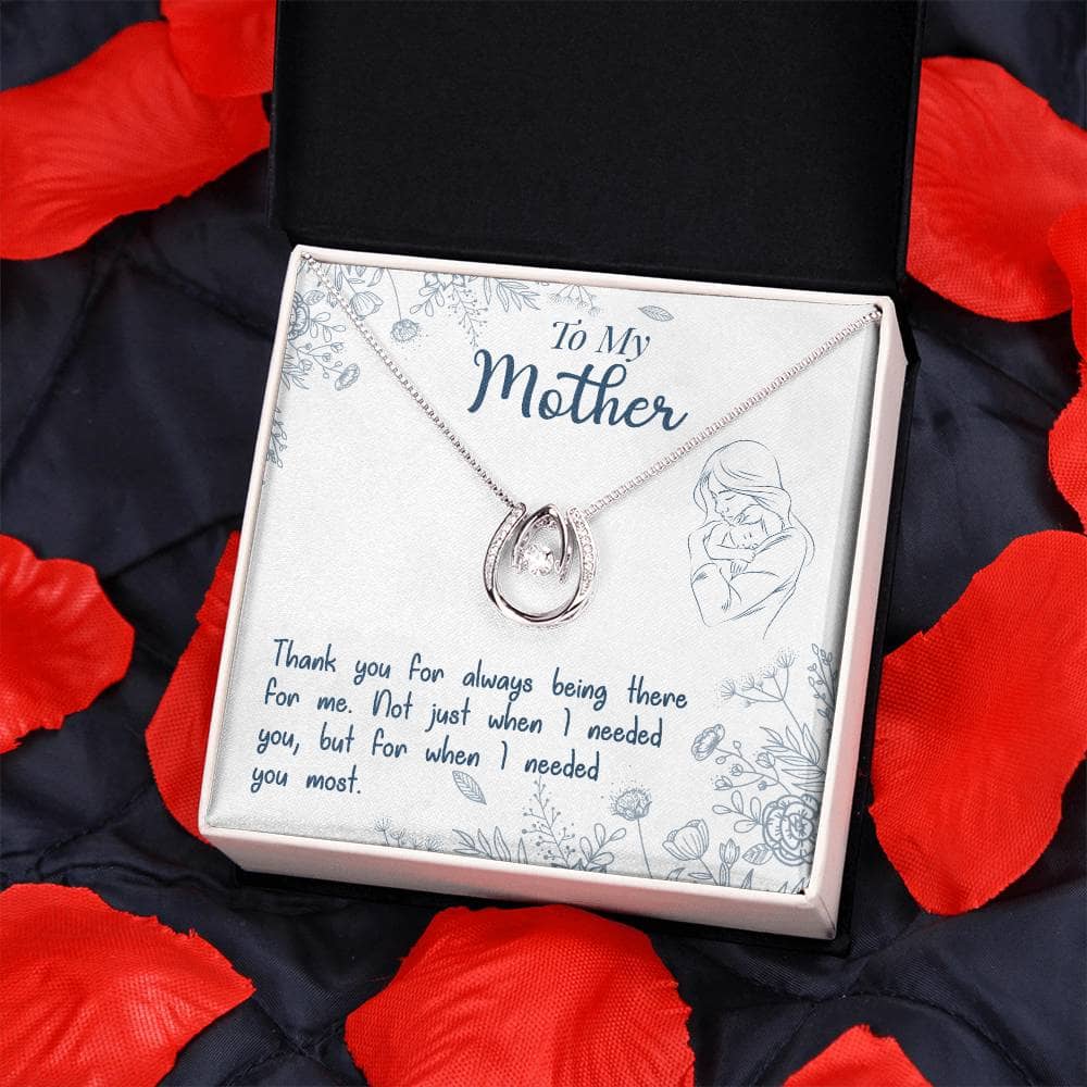 A necklace in a box, symbolizing the powerful love between a mother and child. Perfect for any occasion, this Personalized Mother Necklace features a heart-shaped pendant and a cushion-cut cubic zirconia. Comes in an elegant mahogany-style box with LED lighting.