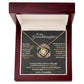 A necklace in a mahogany-style LED-lit box from the Personalized Granddaughter Necklace Collection.