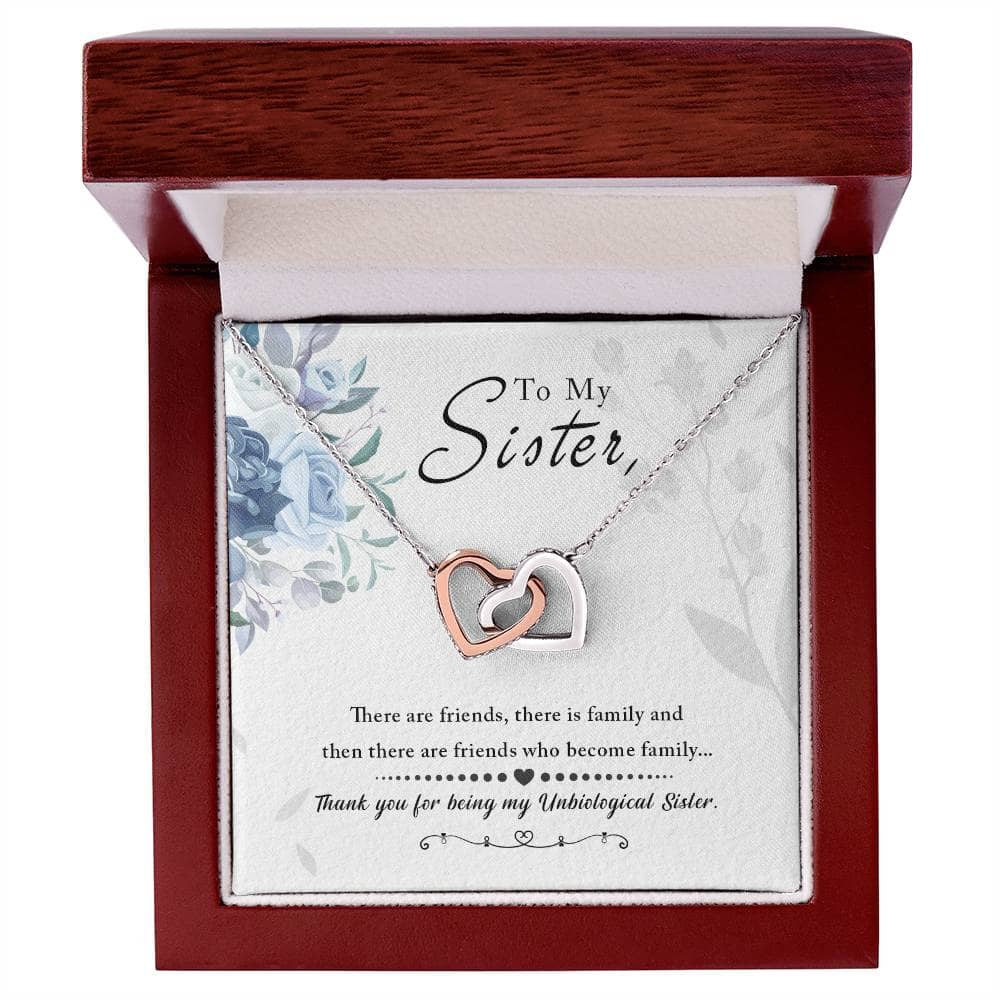 A close-up image of the Personalized Soul Sister Necklace with Heart Pendant, delicately packaged in a luxurious mahogany-style box adorned with captivating LED lighting.