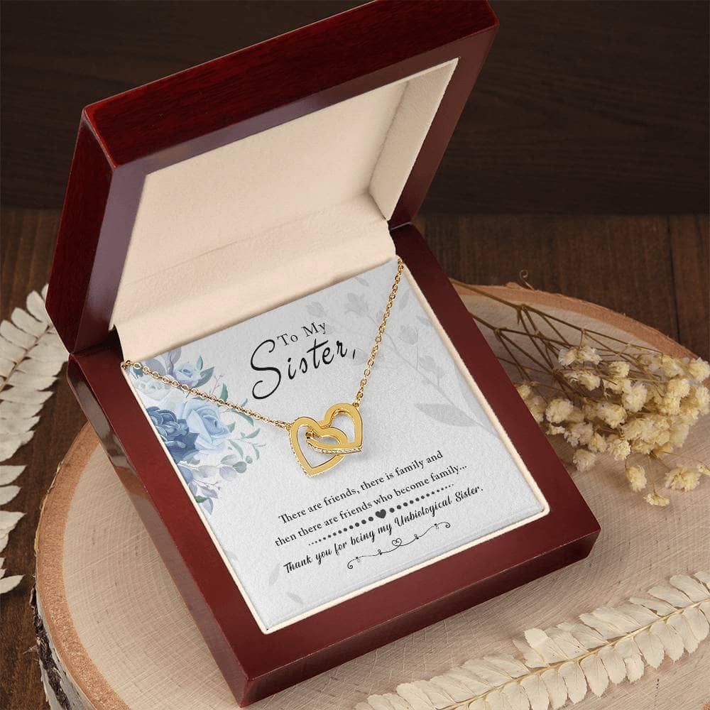 A gold heart necklace in a box, symbolizing the enduring bond of soul sisters. Crafted with precision and care, this Personalized Soul Sister Necklace features a heart-shaped pendant adorned with cubic zirconia. Delivered in an opulent mahogany-style box with captivating LED lighting.