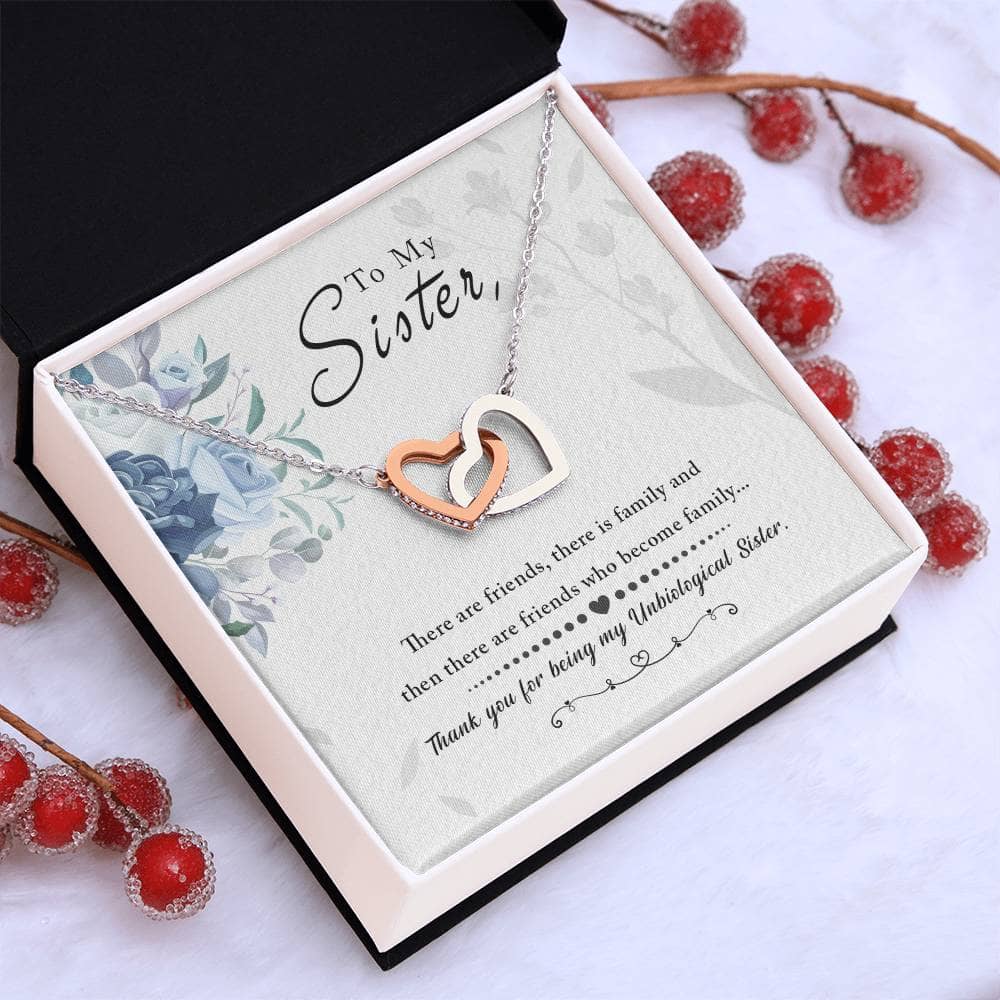 A close-up image of the Personalized Soul Sister Necklace with Heart Pendant, delicately packaged in an opulent mahogany-style box adorned with captivating LED lighting.