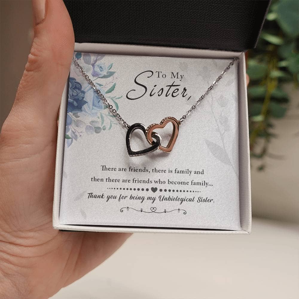 A hand holding a Personalized Soul Sister Necklace with Heart Pendant, symbolizing enduring love and sisterhood.