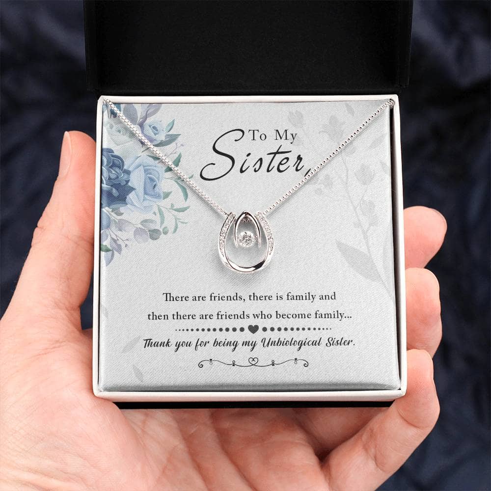 Alt text: A hand holding a Personalized Soul Sister Necklace, Elegant Heart Pendant, in a box.