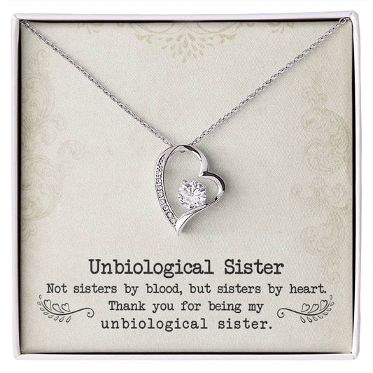 Alt text: "Personalized Unbiological Sisters Necklace in a box with diamond heart pendant"