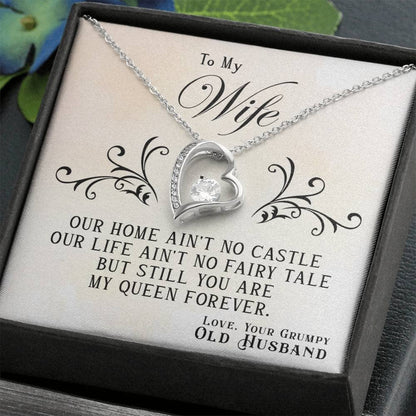 Alt text: "Personalized Wife Necklace: Radiant heart-shaped pendant with cushion-cut cubic zirconia centerpiece. Adjustable chain for perfect fit. Comes in elegant mahogany-style box."