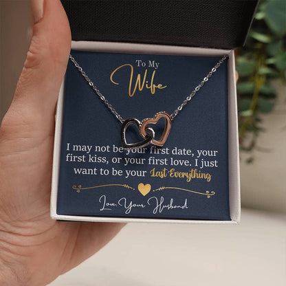 Alt text: "Personalized Wife Necklace: Hand holding heart pendant with cubic zirconia stones in a box"