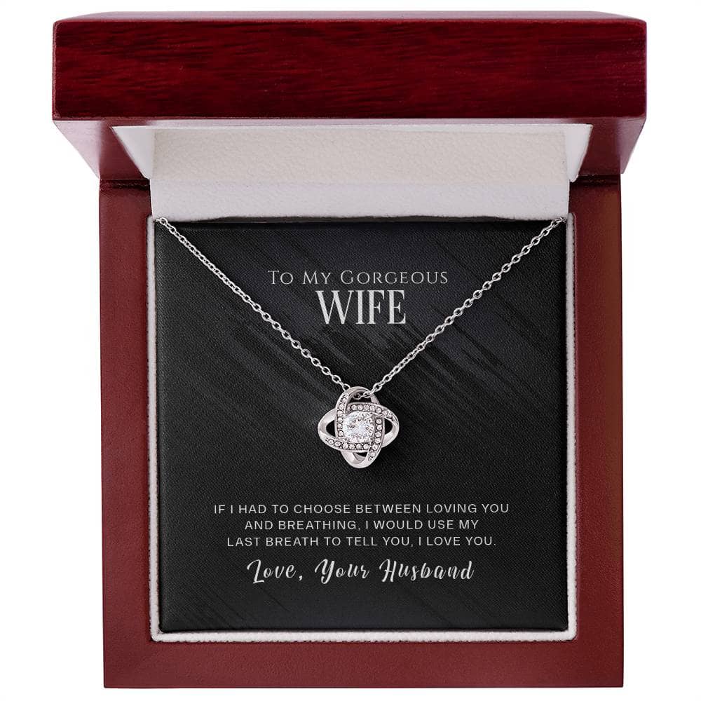 A personalized wife necklace with an elegant love knot design, beautifully presented in a mahogany-style box with an LED light.