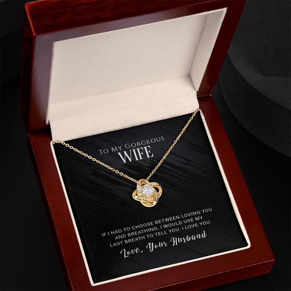 Alt text: "Personalized Wife Necklace - Elegant Love Knot Design in a box, featuring a gold necklace with a dazzling cubic zirconia pendant."
