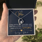 Alt text: "Hand holding 'Forever Yours' Wife Necklace with heart-shaped pendant and cubic zirconia stone in mahogany-style box"