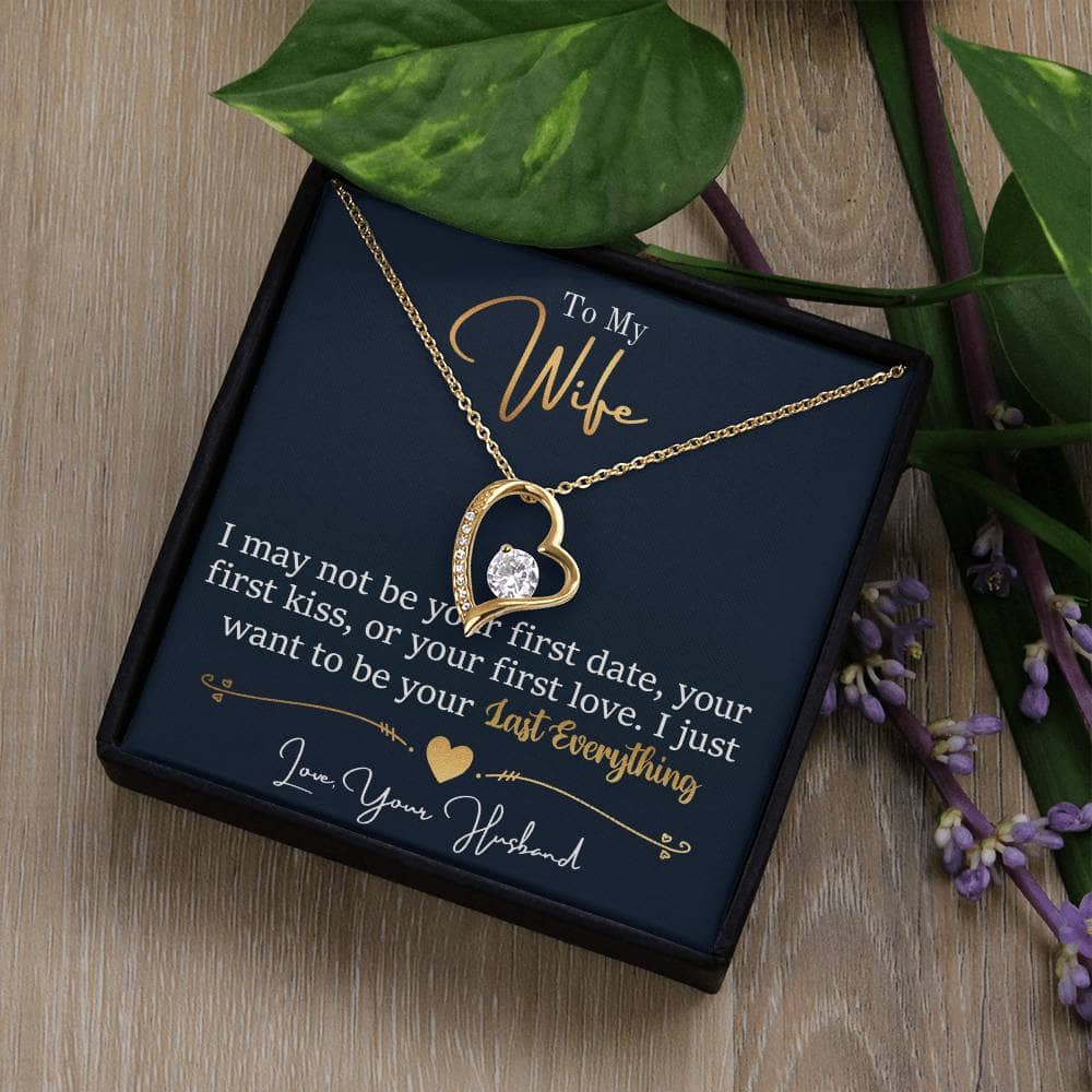 Alt text: "Personalized Wife Necklace: Heart-shaped pendant in a box, featuring a cubic zirconia stone. Crafted in white or yellow gold finishes. Adjustable chain for a perfect fit."