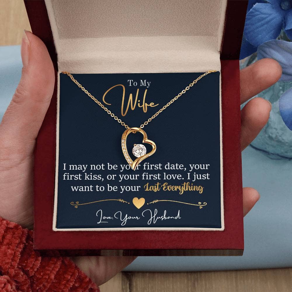 A hand holding a necklace in a box - Personalized Wife Necklace: Elegant Love Symbol With Cubic Zirconia