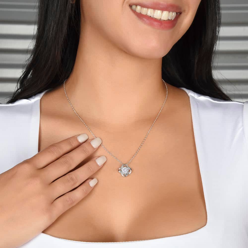 Alt text: "Woman wearing a personalized wife necklace with a heart-shaped pendant and cubic zirconia. Adjustable chain for a perfect fit."