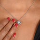 Alt text: "Close-up of a woman wearing a personalized wife necklace with a heart-shaped pendant and a sparkling cubic zirconia."