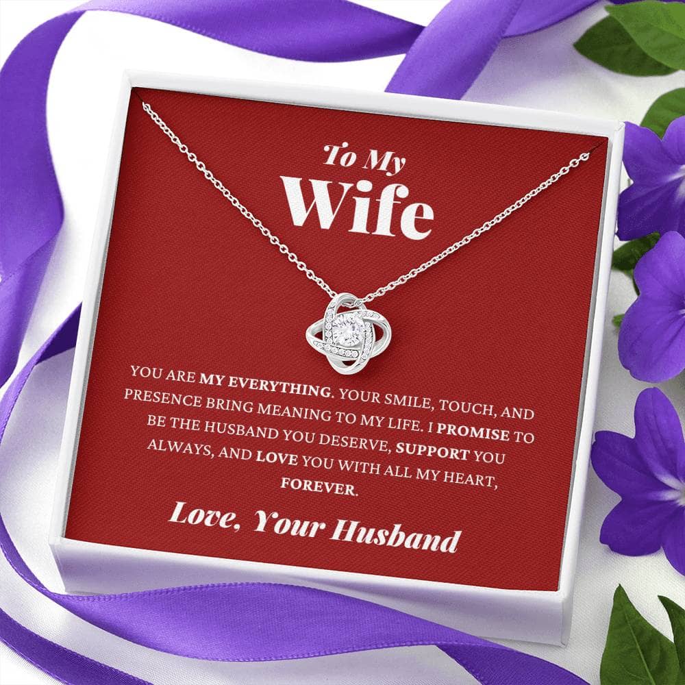 Alt text: Personalized Wife Necklace: Heart pendant in a box with purple flowers