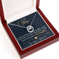 Alt text: "Personalized Wife Necklace: A necklace in a box, featuring a heart-shaped pendant crafted from cubic zirconia."