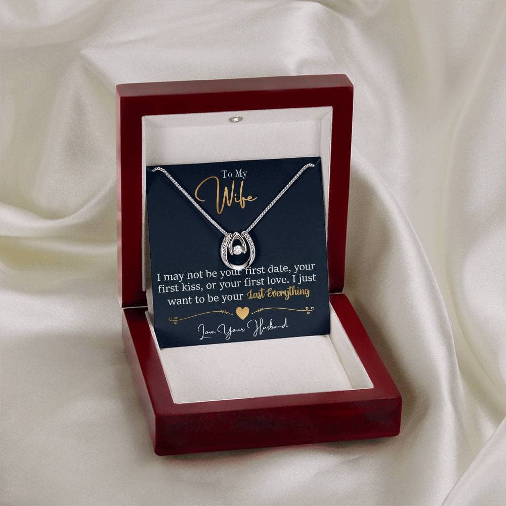 Alt text: "Personalized Wife Necklace: A heart-shaped pendant with a diamond-like stone, elegantly presented in a mahogany-style box with LED lighting."