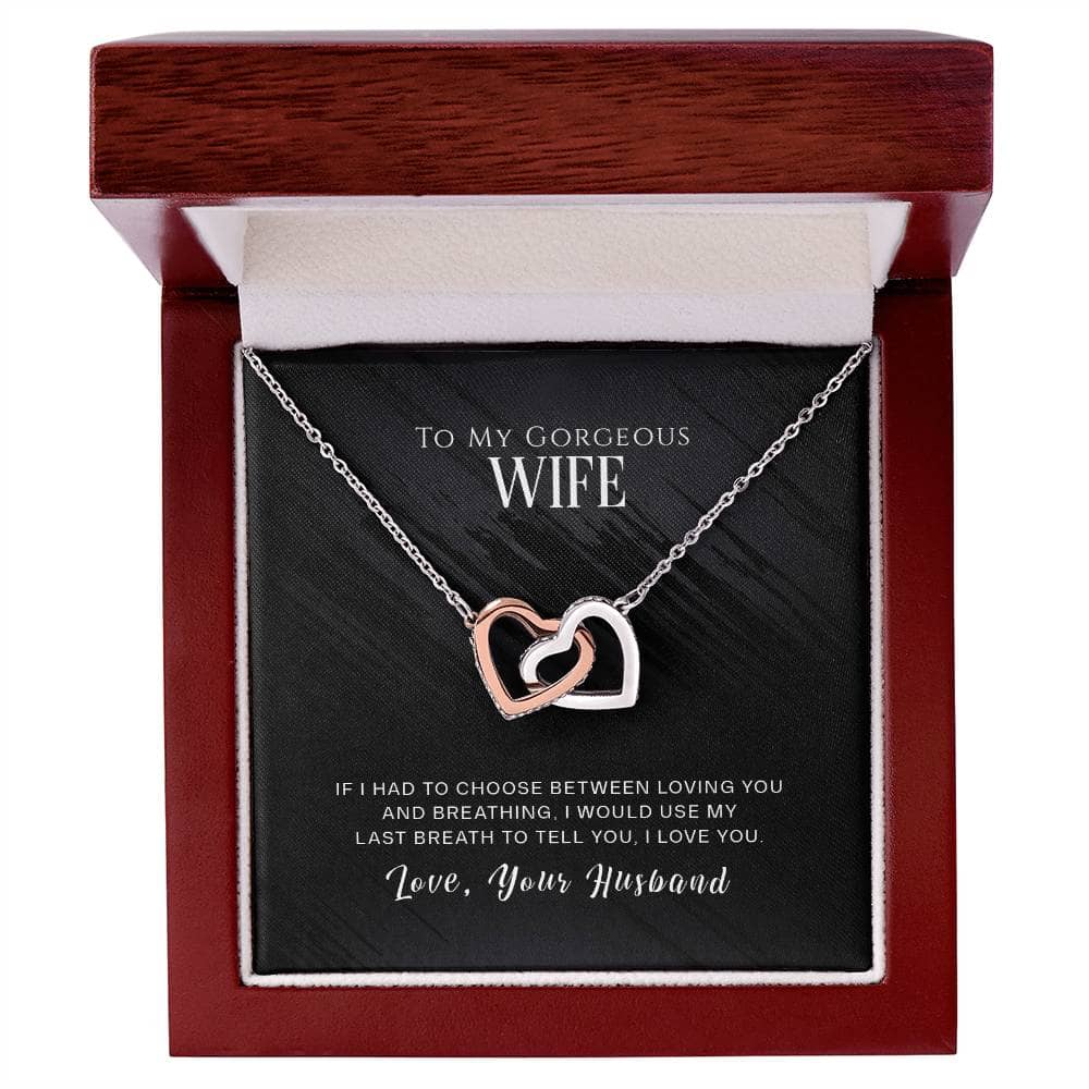 Heart-shaped necklace in box with loving message from husband.