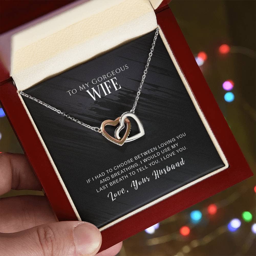 Heart-shaped necklace in box with love message for wife.