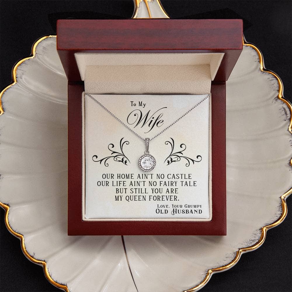 Alt text: "Queen's Embrace" Necklace - Stainless steel pendant with cushion-cut cubic zirconia centerpiece and halo of smaller stones, on an adjustable box chain.
