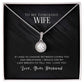 Alt text: "Eternal Hope Necklace - A radiant white gold pendant with a cushion-cut cubic zirconia centerpiece, surrounded by sparkling crystals. Adjustable box chain length. Comes in an elegant gift box."