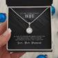 A hand holding the Personalized Wife Necklace - Symbol Of Love & Connection in a box.