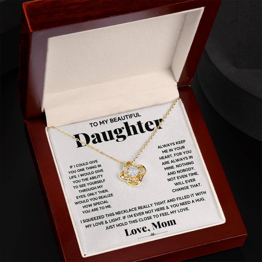 A premium personalized daughter necklace with a heart pendant, presented in an exquisite mahogany-style box.