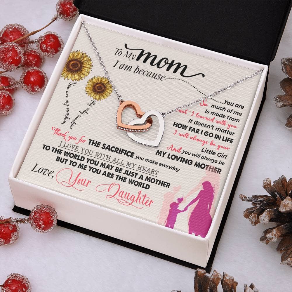 Alt text: "Premium Personalized Mother Necklace in a box with pine cones and berries"