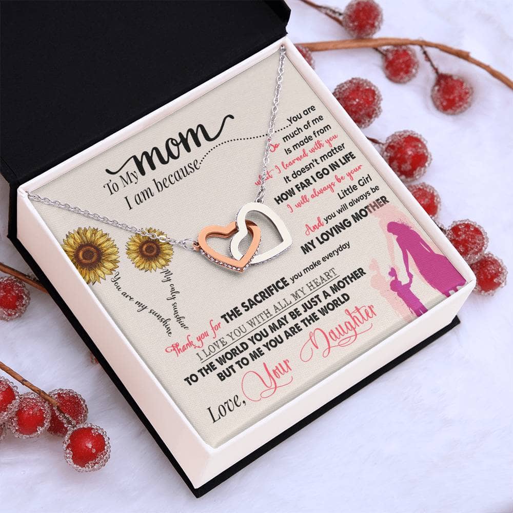 Alt text: "Premium Personalized Mother Necklace in a box - a necklace with a heart-shaped pendant, adorned with a cushion-cut cubic zirconia, symbolizing a mother's love and connection with her child."