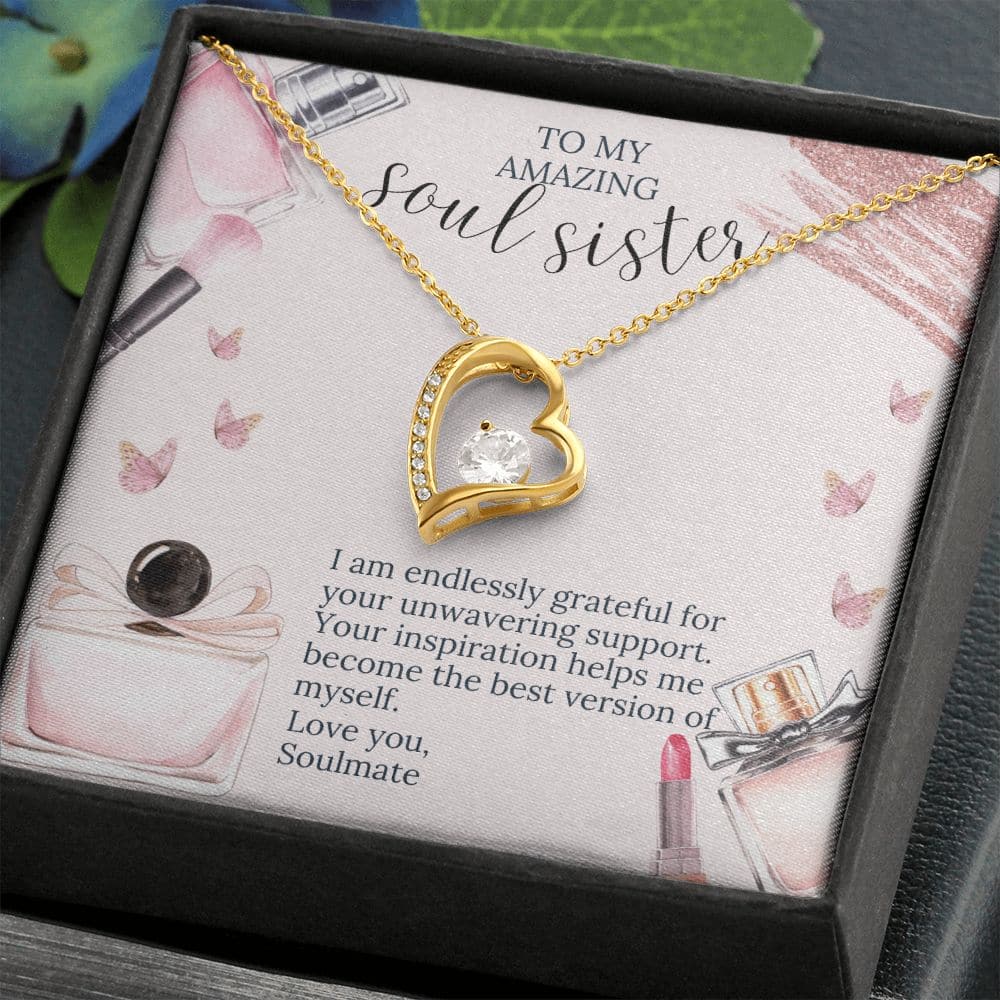 Alt text: "Soul Sister Unity Necklace Set - A gold heart pendant with a large diamond, adorned with shimmering crystals, in a box."