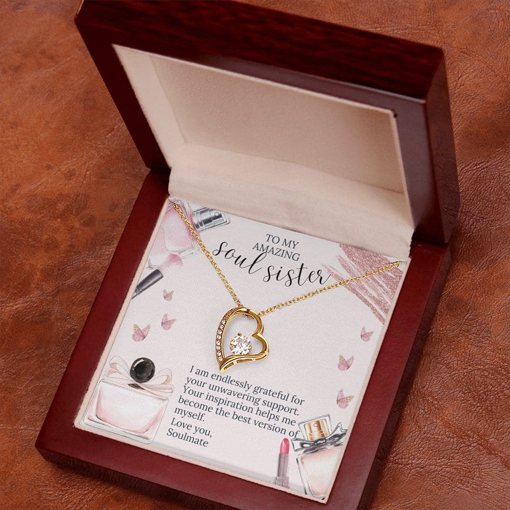 Alt text: "Soul Sister Unity Necklace Set - A necklace in a box with a gold heart pendant adorned with a diamond-like crystal."
