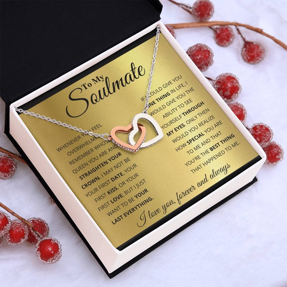 A necklace in a box with interlocking hearts, symbolizing an unshakable bond.