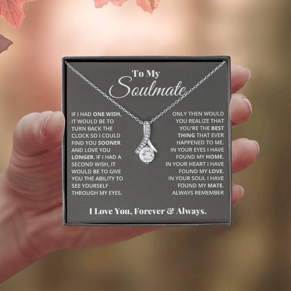 A hand holding a Personalized Soulmate Necklace, a symbol of everlasting love and commitment.