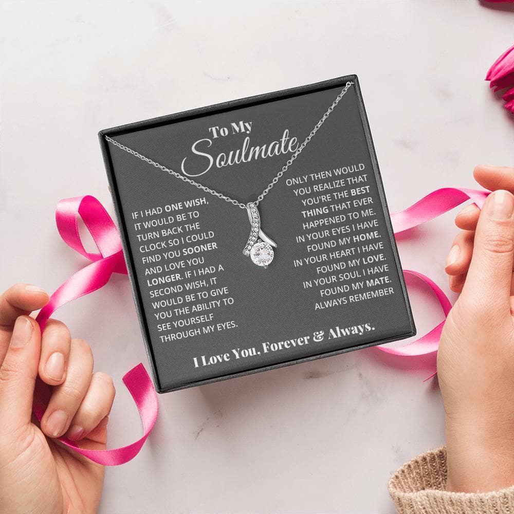 Alt text: "Hands holding a personalized Soulmate Necklace in a luxurious box"