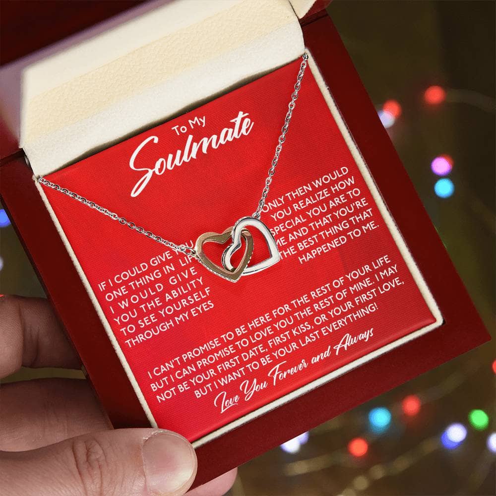 A hand holding a Special Soulmate - Interlocking Hearts Custom Necklace, a symbol of enduring love and commitment.