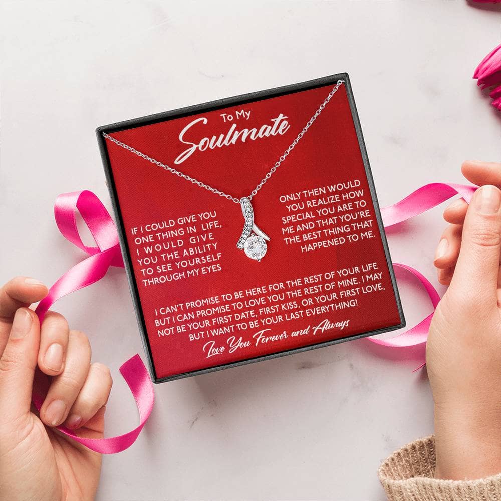 Alt text: "Hands holding a personalized Soulmate Necklace in a luxurious box with LED lighting"