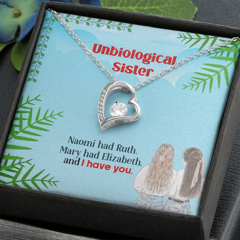 Alt text: "Unbiological Sister Custom Friendship Necklace in a box with diamond pendant and LED-lit mahogany-styled packaging"
