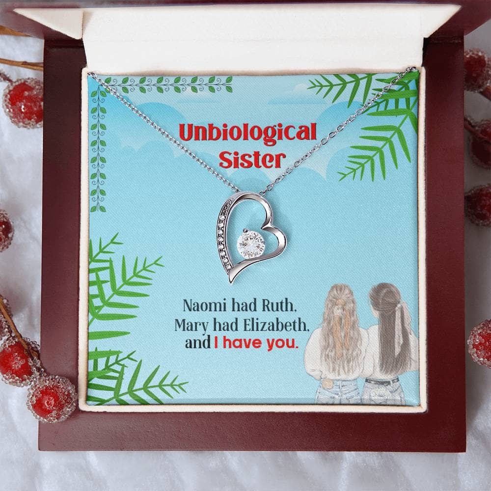 Alt text: "Unbiological Sister Custom Friendship Necklace in a box with interlocking hearts and diamond detail"