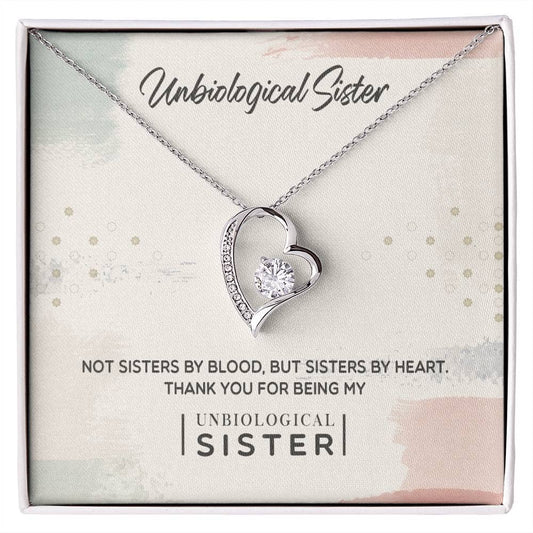 Alt text: "Personalized Unbiological Sisters Necklace in a box, featuring a diamond heart pendant"