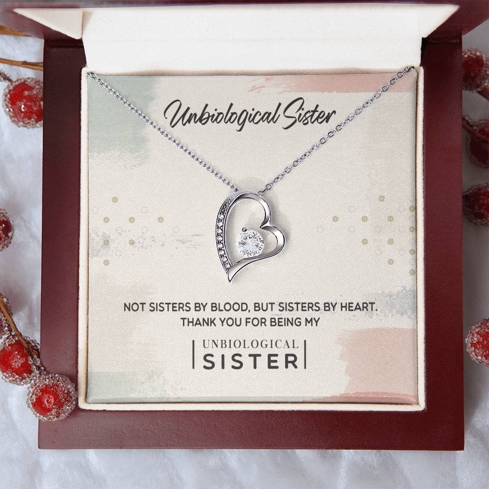 Alt text: Personalized Unbiological Sisters Necklace in a mahogany-style box with LED lighting